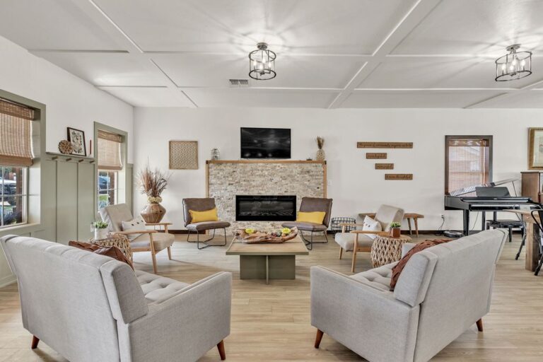 Clubhouse living room with comfortable seating and a fireplace