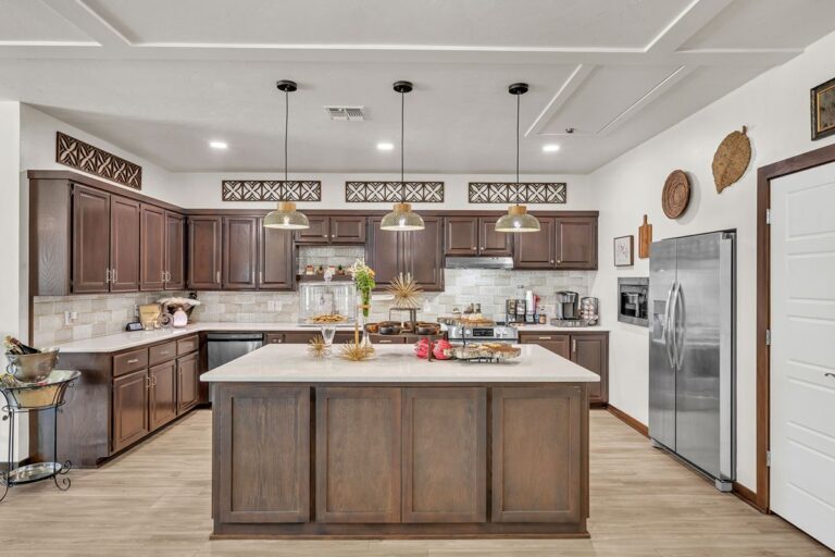 Clubhouse kitchen with a large island and stainless steel appliances