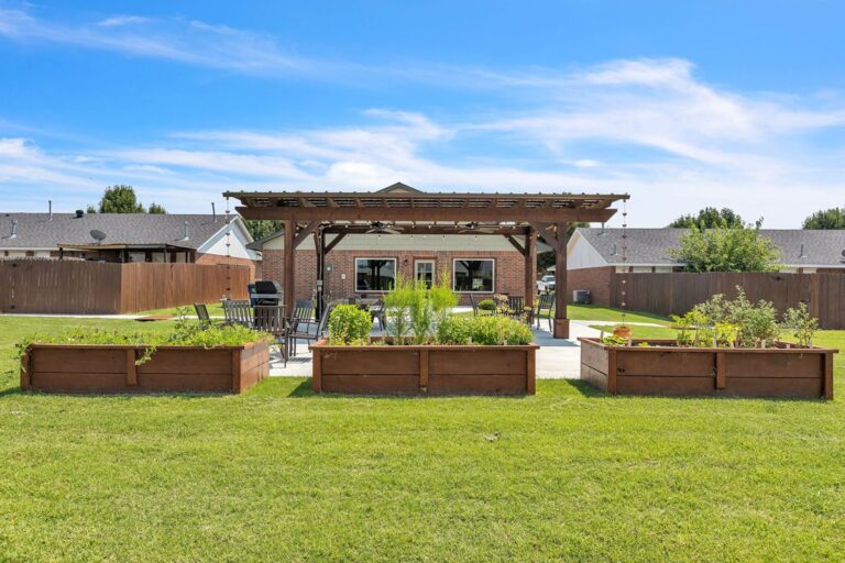Raised garden beds in front of the outdoor pavilion