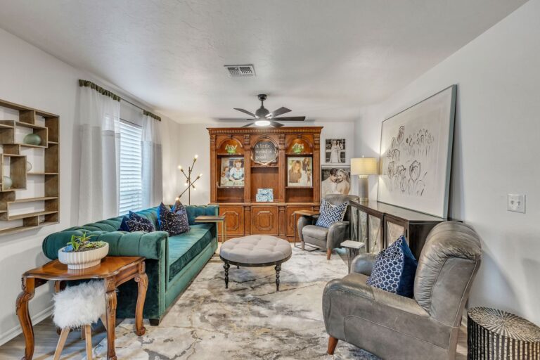Furnished cottage living room with a sofa and natural light